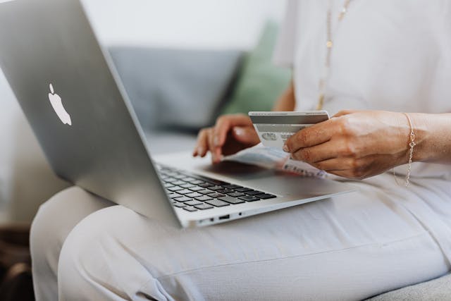 Person making online payments on computer